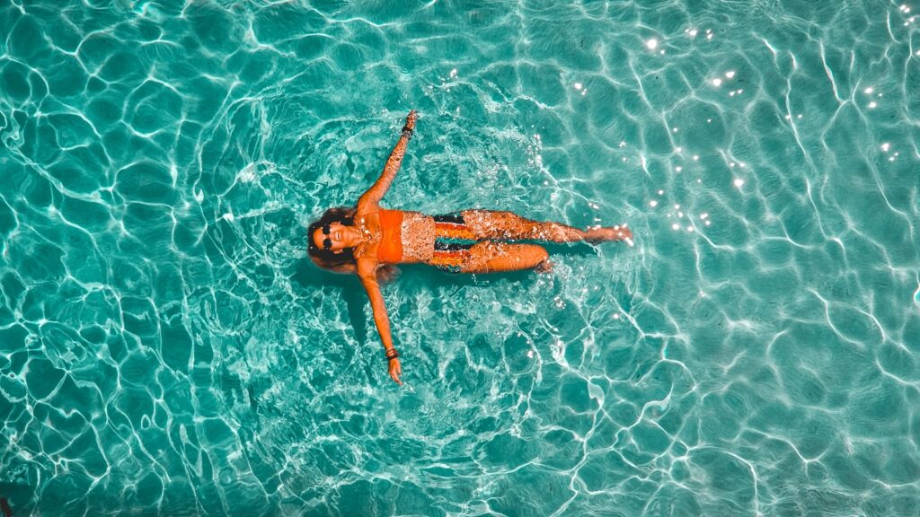 Woman swimming in home pool in Sherwood Park Alberta